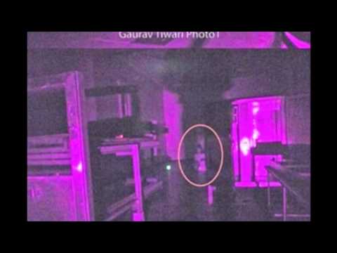 Ghost of young girl kneeling on the floor of an asylum