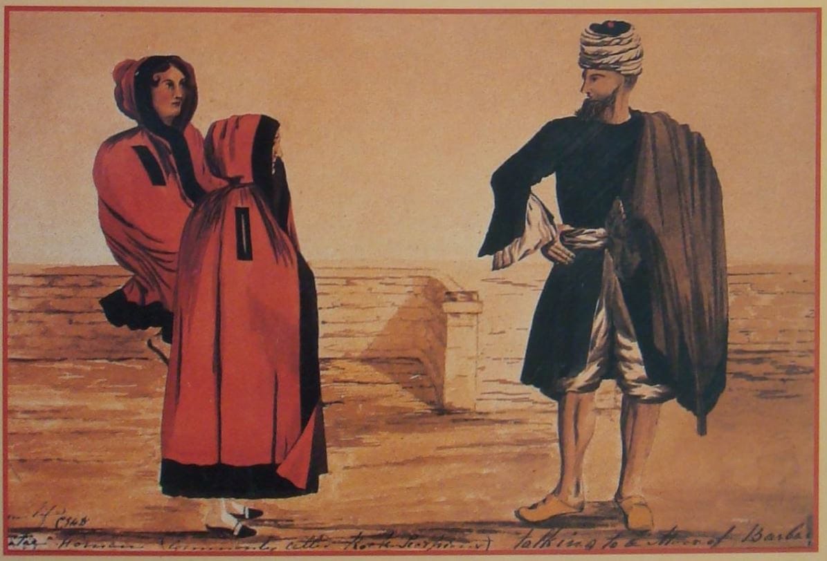 Woman in a red cloak in Gibraltar