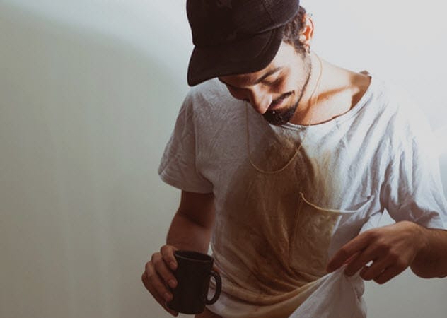 Man spilling coffee