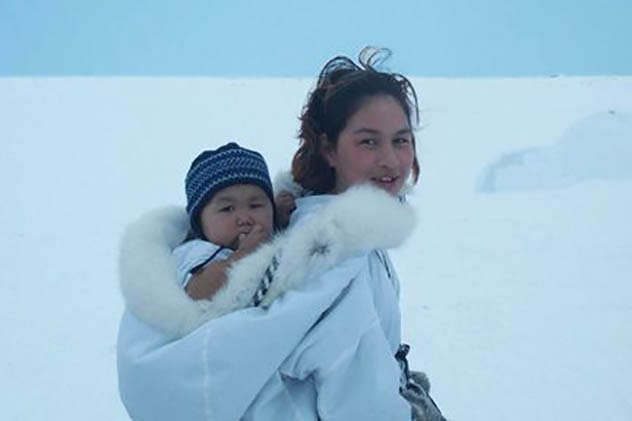Inuit woman with a baby in an Amauti