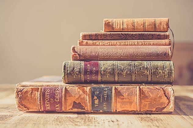 A stack of old books representing bibliophobia