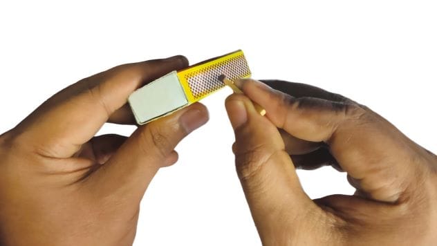 Close-up of a burning match.