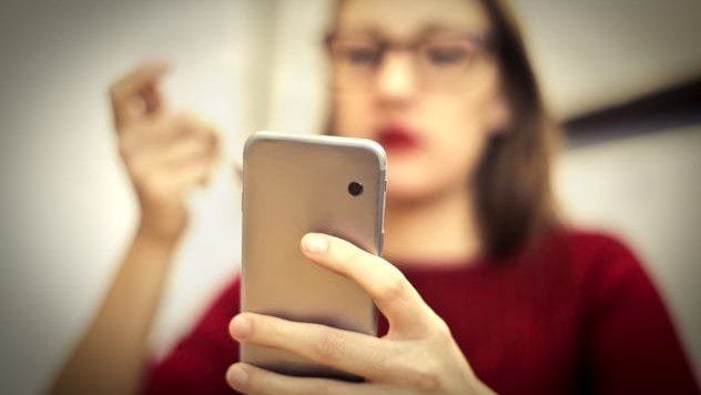 Teenager texting in class
