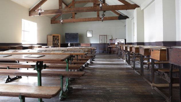 A vintage schoolroom with wooden desks