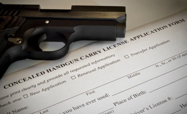 A person holding a concealed gun