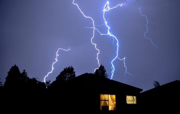 Lightning striking a house