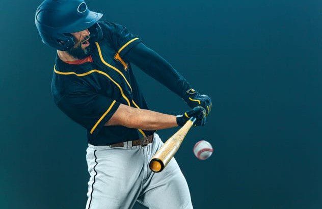 A baseball player swinging at the ball