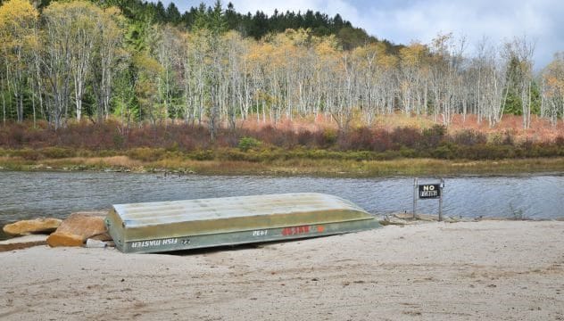 A small boat on a river, representing Walter Fowler's disappearance near the Barren River