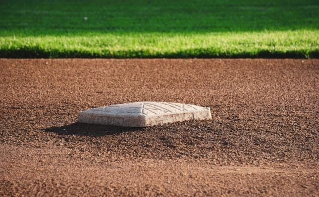 A baseball player moving to the next base