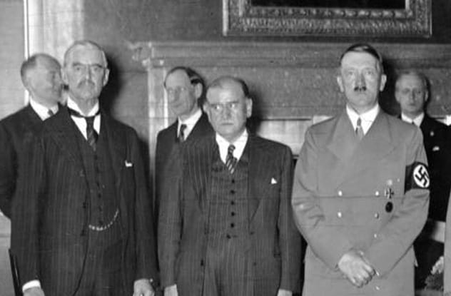 Adolf Hitler looking stern, juxtaposed with the idea of him fearing enemies