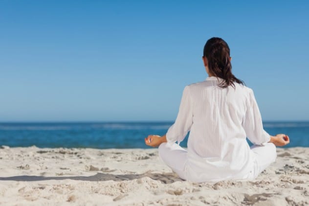 Person meditating peacefully in a calm setting