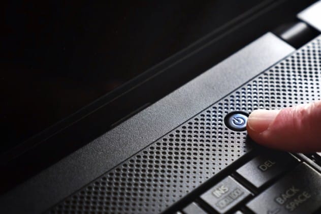 Person happily turning off a laptop