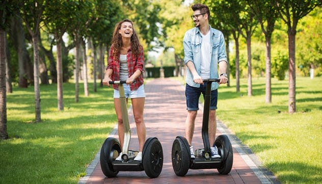 People riding Segways