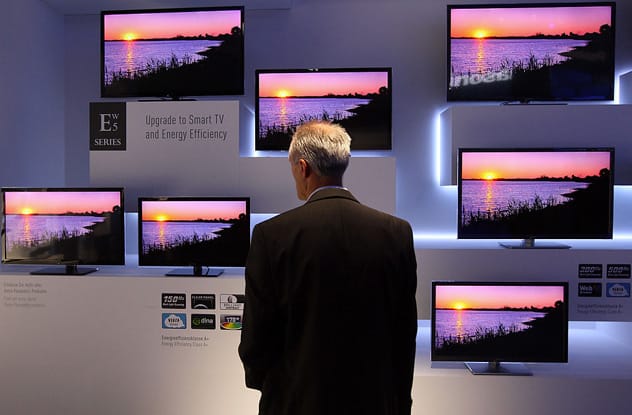 A modern smart TV displaying an app interface in a living room