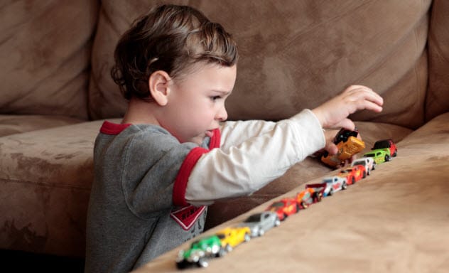 Stylized image of a child's profile, representing autism research