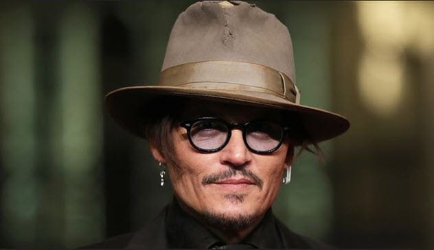 Johnny Depp smiling slightly
