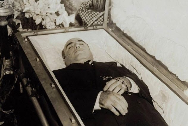 Al Capone lying in his casket during his funeral.