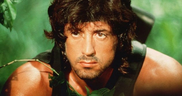 Sylvester Stallone in a suit looking serious