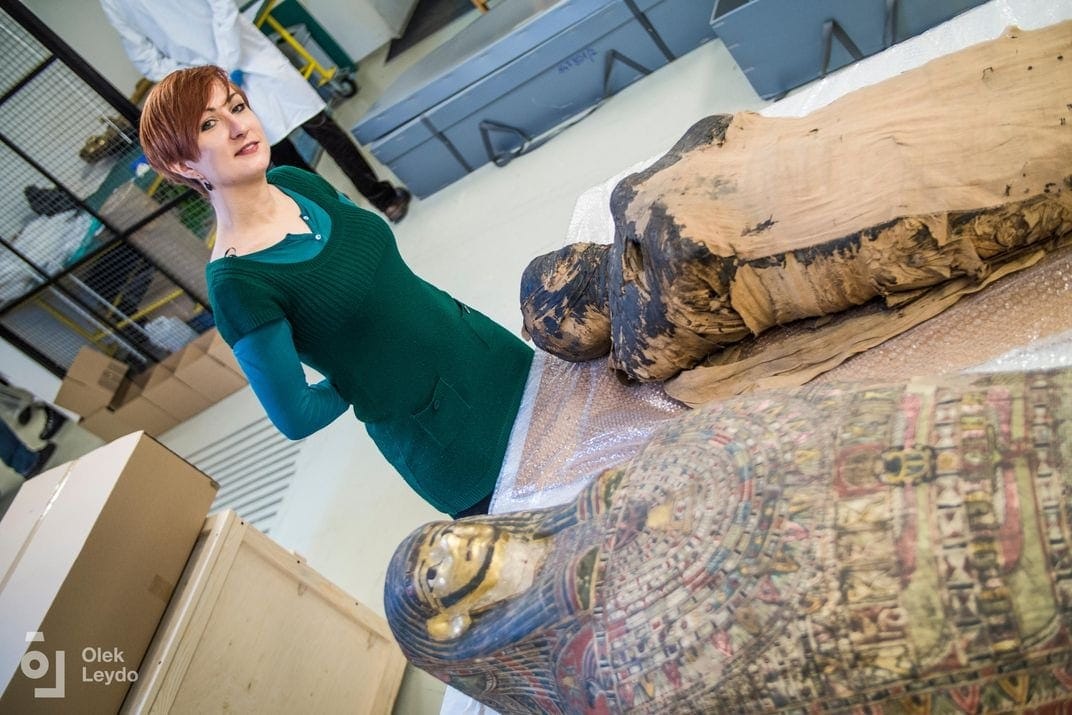 Researchers with the pregnant mummy