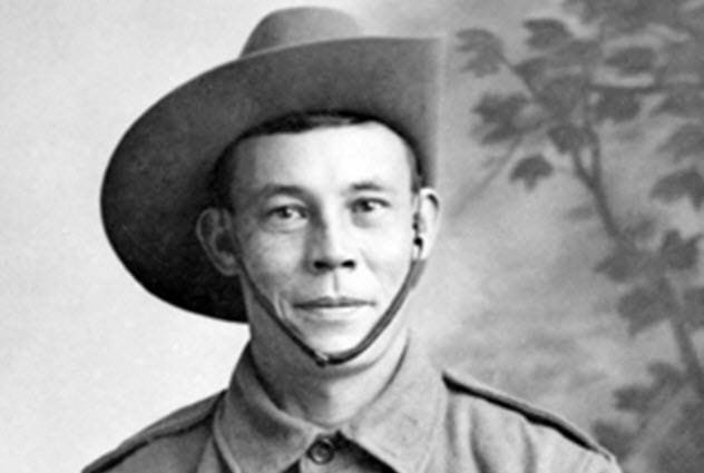 Billy Sing holding his Lee-Enfield rifle