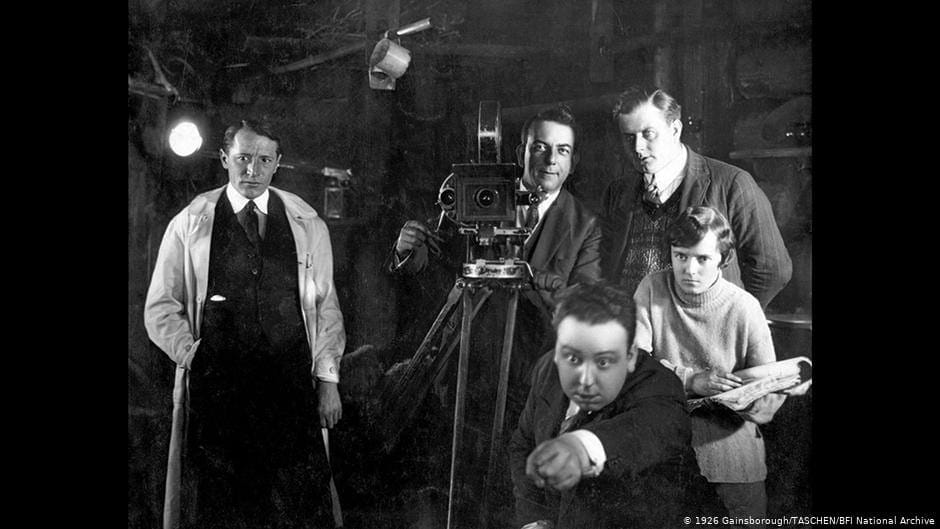 Alfred Hitchcock intensely focused on set