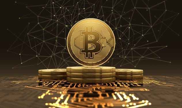 A bitcoin laying on top of some garbage.