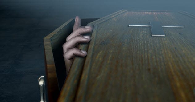 hand reaching out of coffin