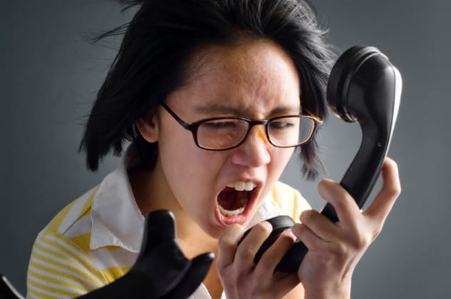 Person yelling into a phone