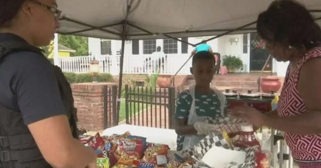 Jermaine Bell offering food to hurricane evacuees