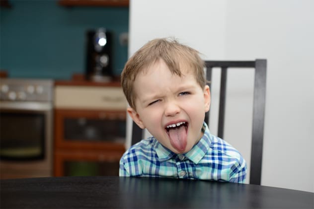 Child sticking their tongue out
