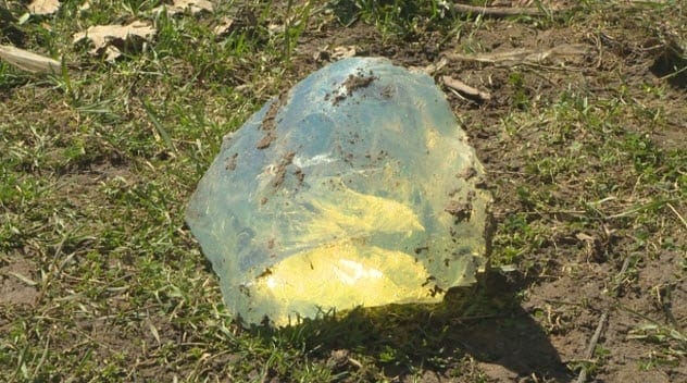 A large, clear, bluish piece of glass or crystal