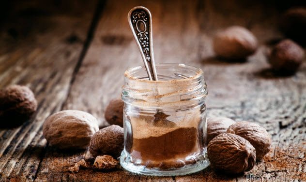 Nutmeg and cinnamon sticks, common spices used as natural sleep aids.