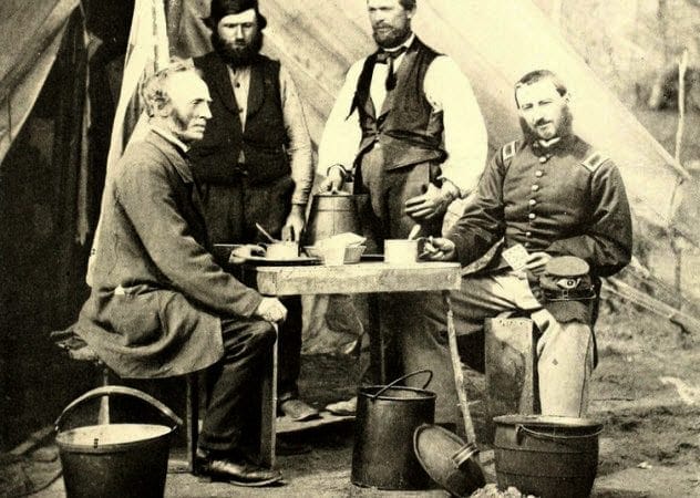 Union soldiers gathered around a campfire with coffee pots during the Civil War