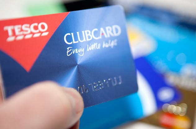A supermarket loyalty card placed on a checkout counter