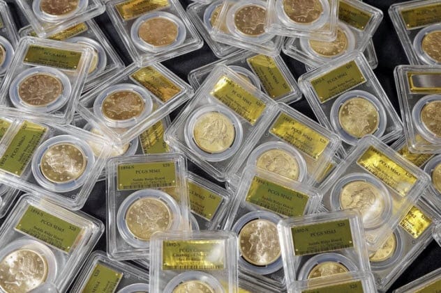 A collection of old gold coins spread out