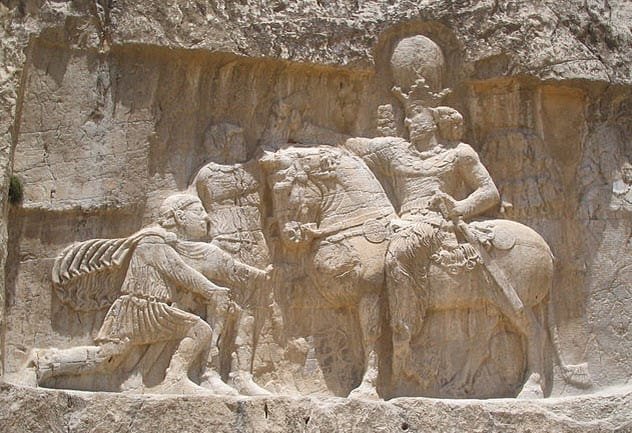 Ancient rock relief depicting a Roman emperor's triumph or victory