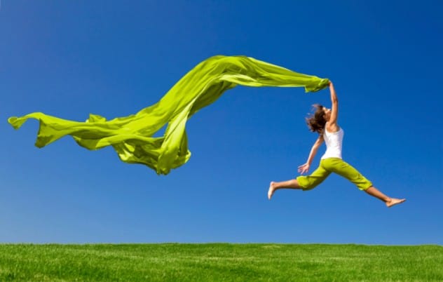 Person joyfully jumping, illustrating a moment of happiness