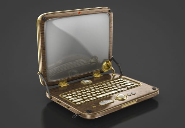 Person using an early model laptop computer