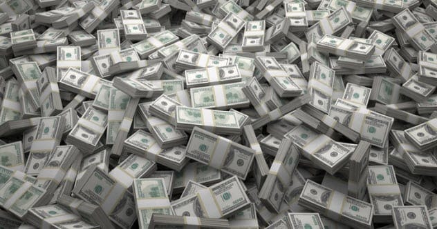 Stacks of money, representing the sugar industry's focus on profit