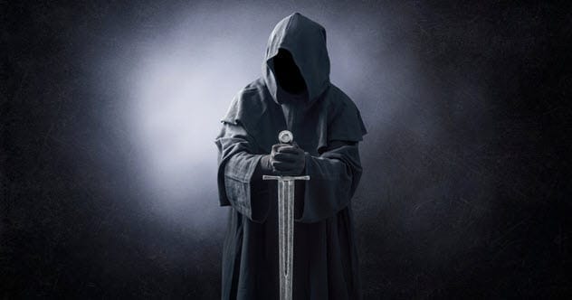 A hooded assassin with a sword