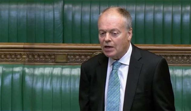 Clive Betts MP, a man in a suit and tie, speaking.