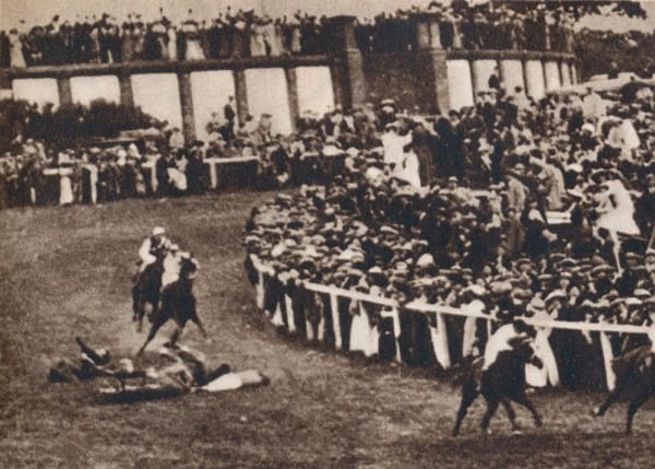 Emily Davison attempting to attach a suffragette banner to the King's horse at Epsom Derby 1913