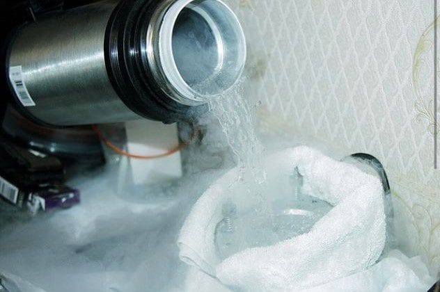 Pouring of liquid hydrogen illustrating gas liquefaction