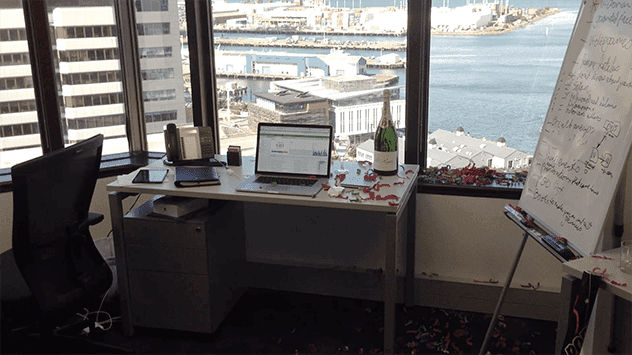 Desk overlooking Wellington harbour, representing Listverse's office