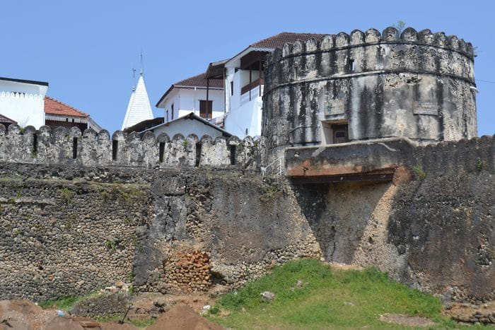 The Old Fort in Zanzibar, a stone structure under a blue sky