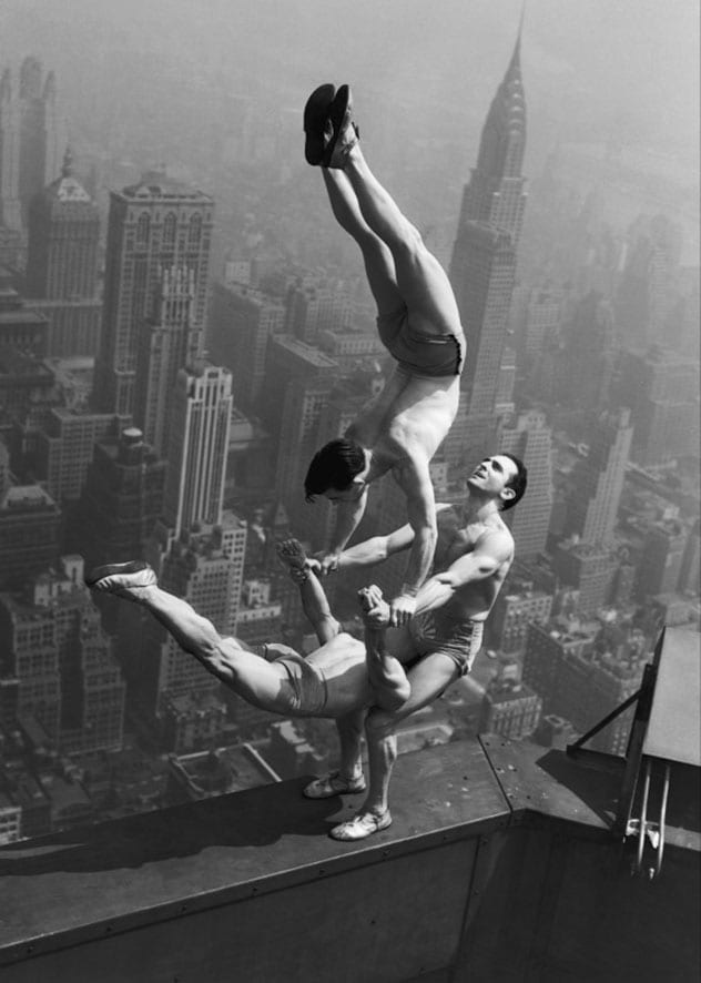Acrobats performing on the Empire State Building