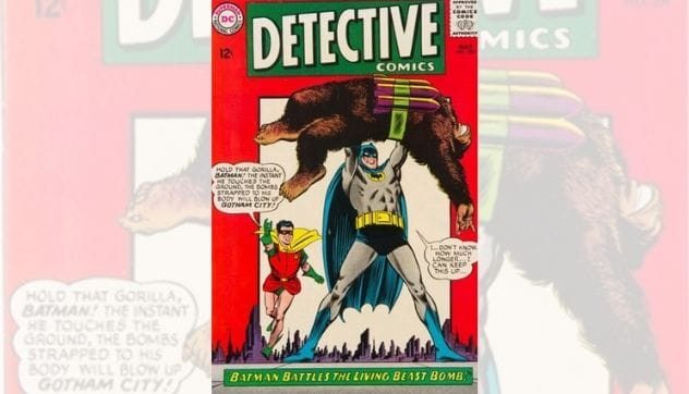 Batman lifting a gorilla with a bomb strapped to it