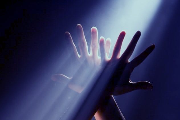Blue light from a UFO entering a child's bedroom window