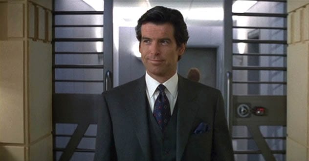 Pierce Brosnan wearing a timeless Brioni charcoal suit