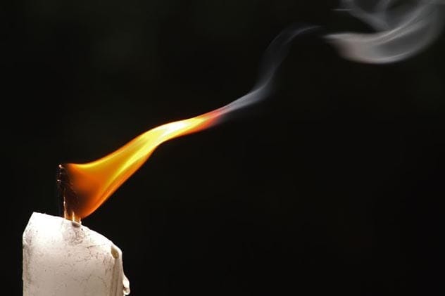 Melting candle illustrating entropy